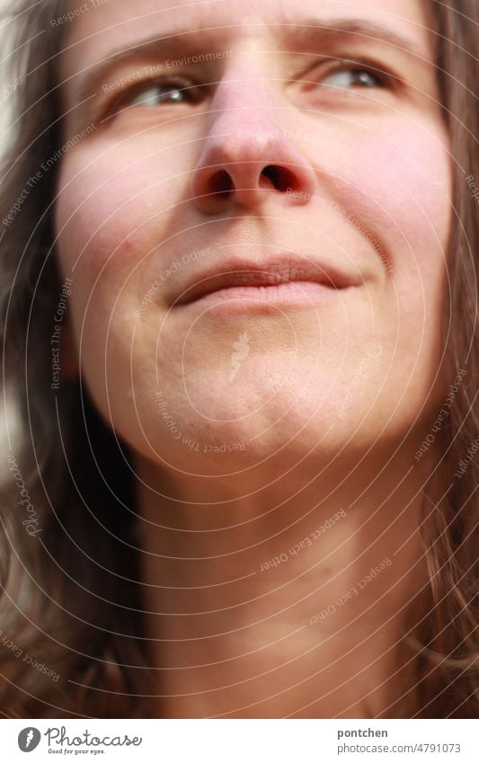 Face of woman looking dreamily to the side Woman Brunette Looking Dream Dreamily Facial expression portrait Feminine Emotions Hair and hairstyles Meditative