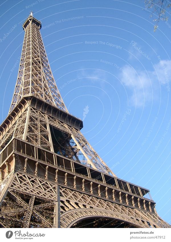 Eiffel Tower in Paris. Photo: Alexander Hauk France Tourism Manmade structures Steel Art Metal Tourist Attraction vacation free time Sky Blue Clouds