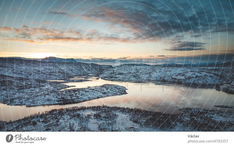 Sunset over a barren Norwegian mountain landscape in the Finnmark region of northern Norway, above the Arctic Circle. Lake nedre Jernvatnet in Nordland