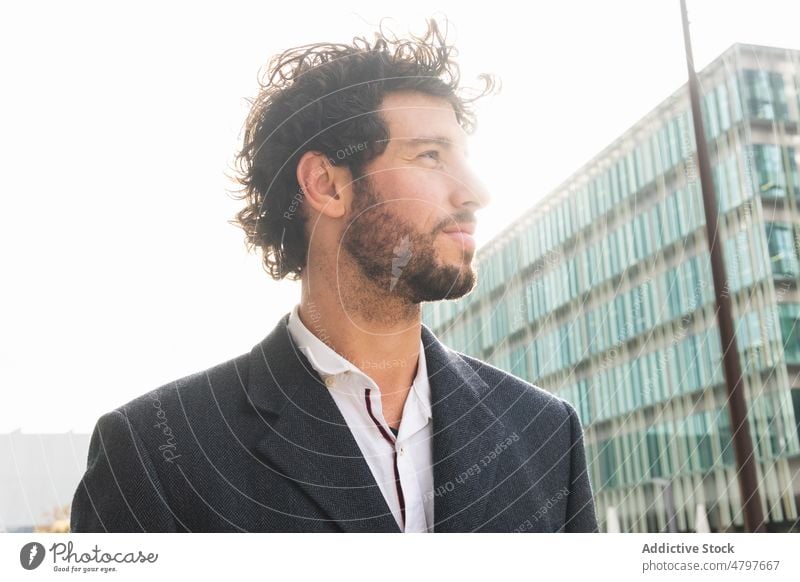 Businessman standing near modern building businessman entrepreneur urban city street formal style office well dressed respectable manager work worker downtown