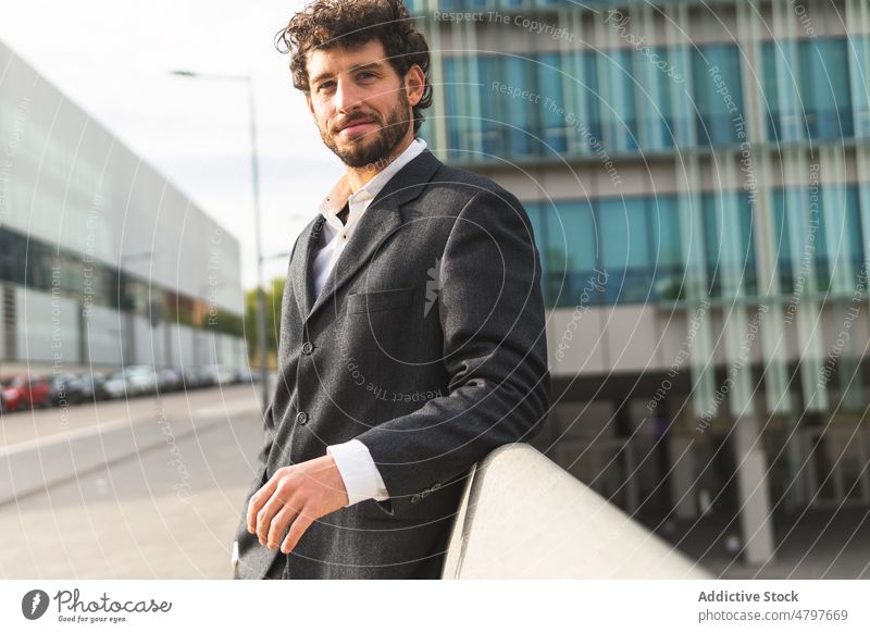 Businessman standing near modern building businessman entrepreneur urban city street formal style office well dressed respectable manager work worker downtown