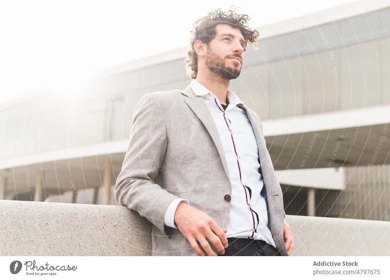 Businessman standing near modern building businessman entrepreneur urban city street formal style office well dressed respectable manager work worker downtown