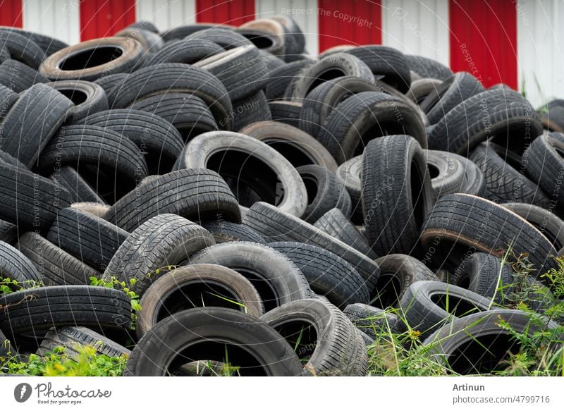 Pile of used tires. Old tyres waste for recycle or for landfill. Black rubber tire of car. Pile of used tires at recycling manufacturing yard. Material for landfill. Pile of second hand tires for sale