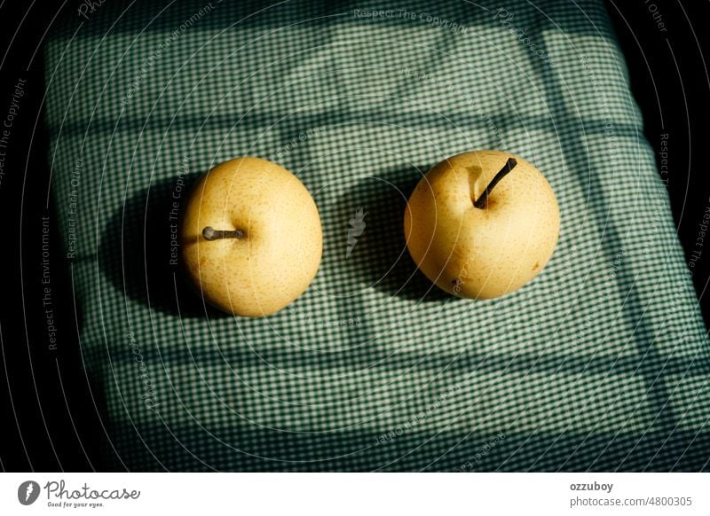 pair of pears fruit healthy yellow fresh juicy background isolated green nature sweet freshness organic two studio 2 vitamin healthy eating closeup diet