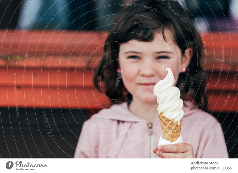 Girl eating ice cream girl lick smile street kiosk summer weekend portrait sweet kid child dessert cute delicious yummy adorable childhood little daytime