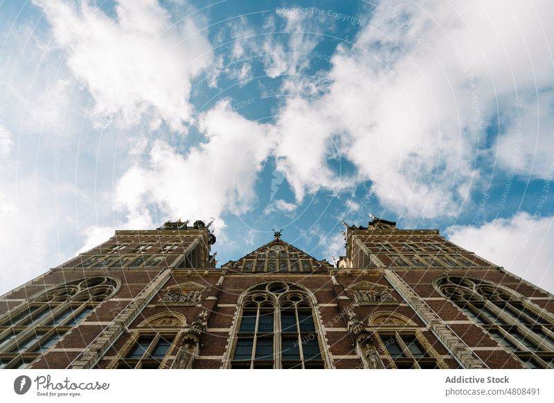 Facade of aged museum building with arched windows under blue sky architecture facade historic sightseeing heritage exterior culture brick wall construction