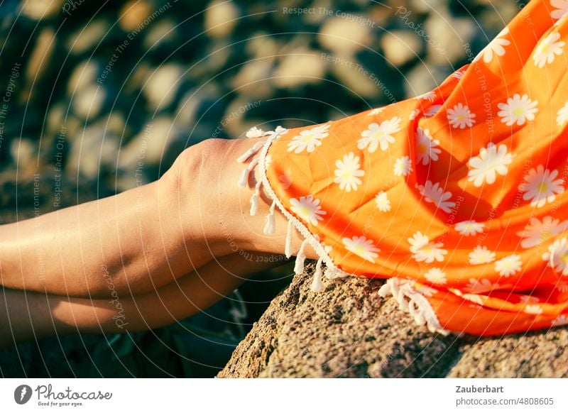 Legs and knees of woman in orange dress in the evening sun leg Knee Woman Dress Orange Evening Sun luminescent relaxed Lie Stretching vacation Relaxation