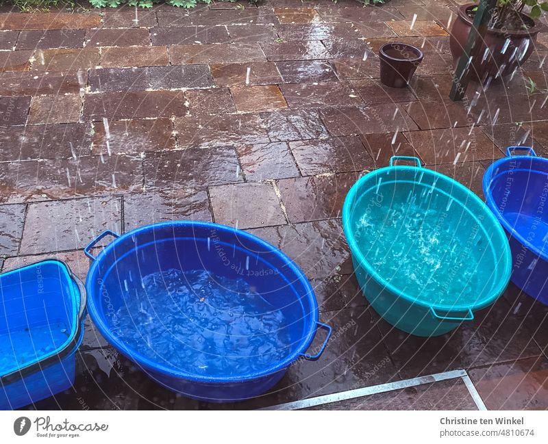 Heavy rain, the water falls from the overflowing gutter directly into the provided laundry tubs heavy rain Rain Water Wet Collect rainwater Laundry tubs