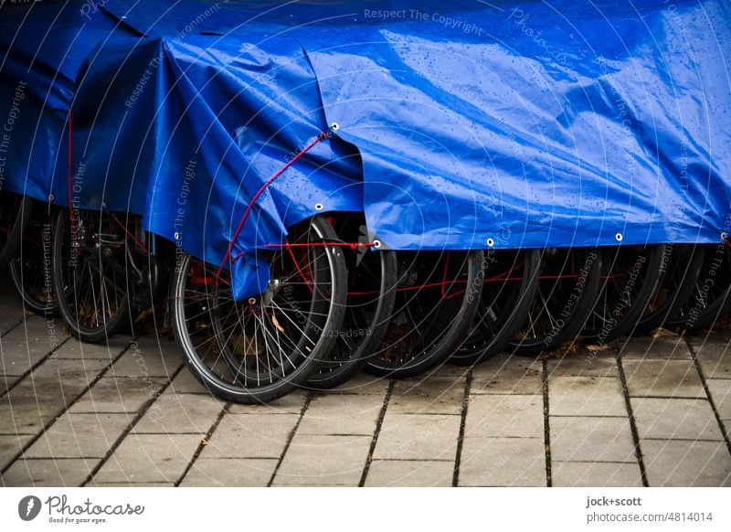 Rental bikes under tarpaulin during the winter break rental bike Mobility Bicycle Means of transport turned off Row Authentic Beaded Collection Side by side