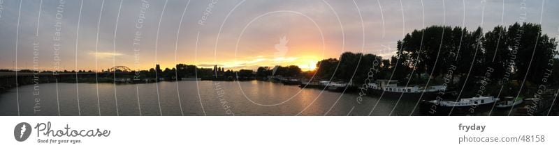 Sunny lake Panorama (View) Wide angle Sunset Watercraft Lake Back-light fiery red experienced Sky River horizontal luminaires Large Panorama (Format)