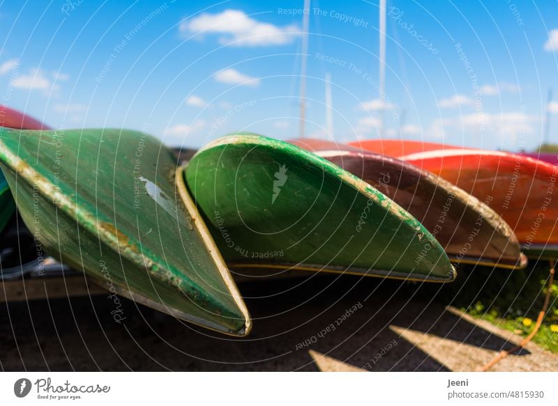 Many canoes ready to go out Canoe Canoe trip Lie bank Water Aquatics Green Red Blue sky Nature Adventure Vacation & Travel Leisure and hobbies Lake Canoeing