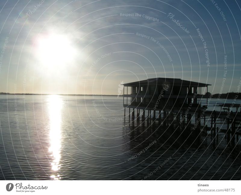 Bay of Utila town Sky Back-light Ocean Honduras House (Residential Structure) Reflection Afternoon Sun sea Water Hut Pole Island Cuba caribbean sea