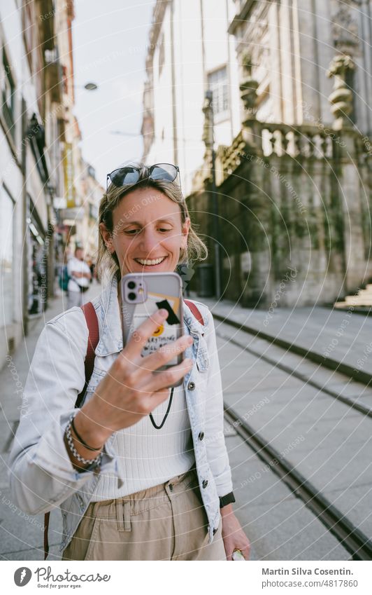 Blonde young woman in the streets of Porto, Portugal architecture beautiful camera caucasian colorful couple culture douro downtown female friends friendship