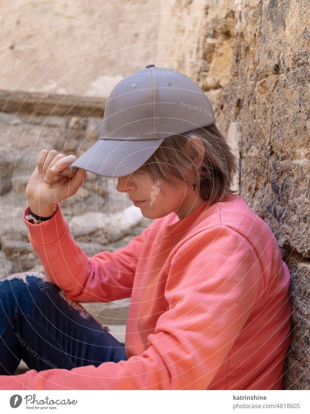 Teenager girl in grey baseball cap and long sleeve shirt outdoor, mockup teenager pink Caucasian long sleeve visor profile t-shirt teen girl female copy space