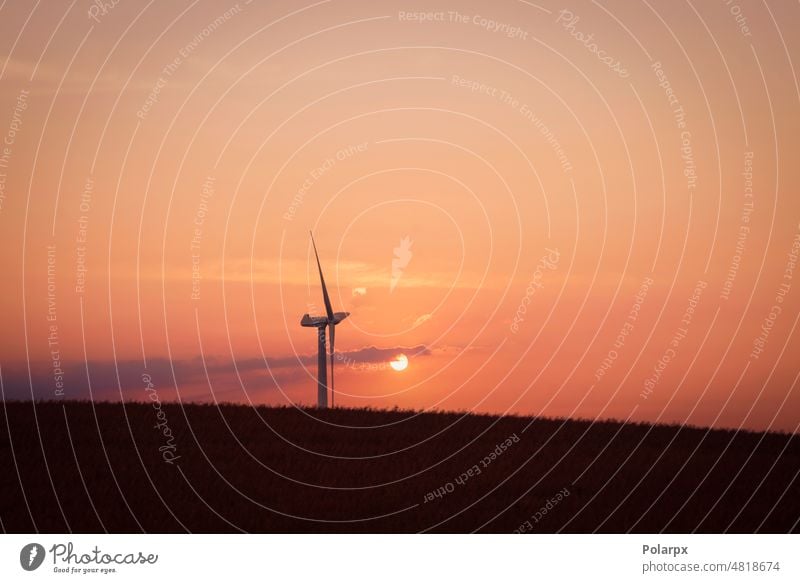 Windmill in the sunset on a hill innovation quiet painting nobody electrical colorful red horizon sundown sustainable rotation development natural background