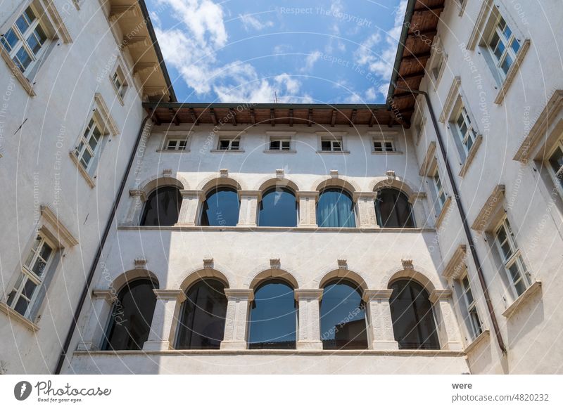 Residential houses in the Italian town of Arco on Lake Garda under blue sky and light clouds Holiday Italian city Italy Mediterranean Recreation copy space