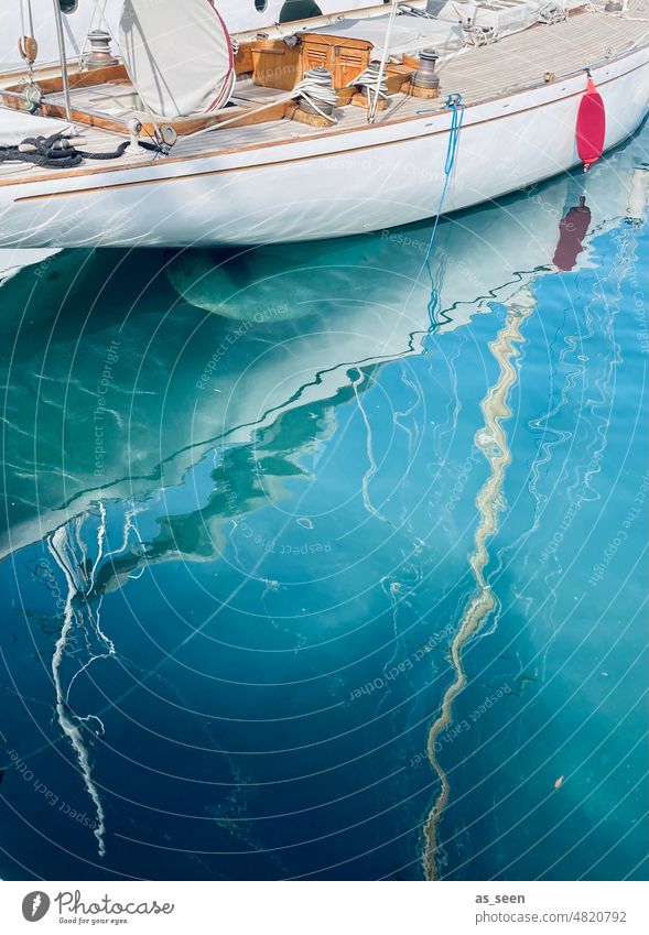 Boat in harbor boat reflection Mediterranean sea Red Blue Partially visible White Brown Summer Reflection Water Colour photo Exterior shot Deserted