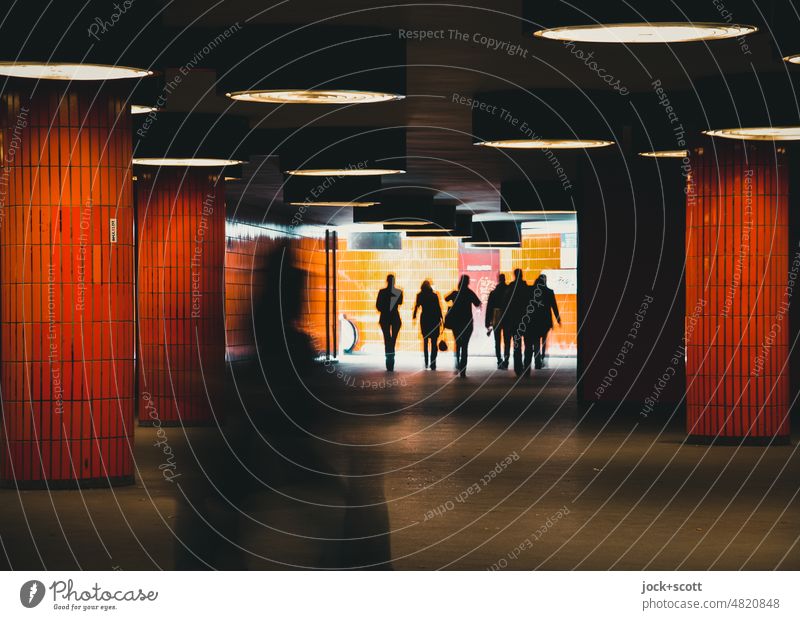 Underpass for pedestrians in orange Orange Lanes & trails Passage Subsoil Silhouette motion blur Going Back-light Tunnel Pedestrian Mobility Skylight