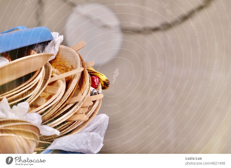 Full to the brim with trash... Palm leaf disposable plates pile up, in between some fruit and a lonely butt Trash Trashy Disposables Disposable plates