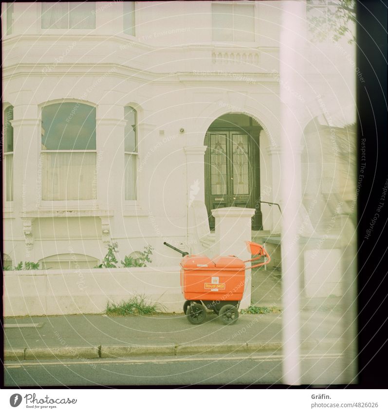 When the Royal Mail rings twice - Royal Mail delivery van outside British terraced house royal mail Delivery person Postman House (Residential Structure)