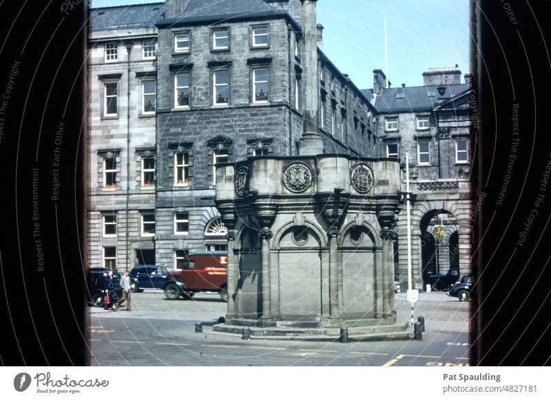 The Mercat Cross of Edinburgh, Scotland Architecture United Kingdom cityscape Tourism Travel Landmark History Historical Vintage 1950's Old Cars