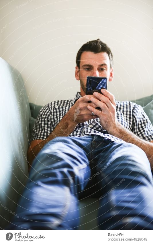 Man looking at his cell phone Cellphone Reading hands social media