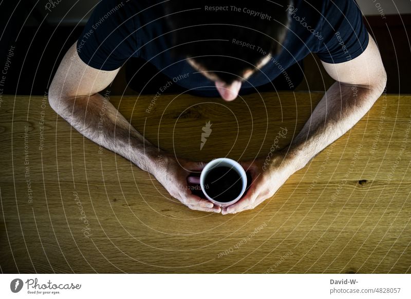 Coffee break - man at table with a cup of coffee Mug Drinking Break time-out Man Sit Table To enjoy tranquillity To have a coffee