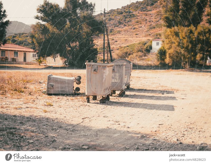 in the end a garbage can fell over dustbin Sand Nature warm Summer Large waste garbage can Container Environment Euboea Row Landscape Tree Hill Sunlight Warmth