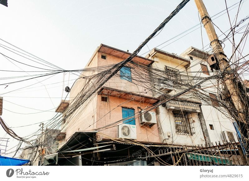 tangled cables Cable Terminal connector Chaos havoc everything under control apricot/blue like spider webs Muddled Technology Telecommunications Electricity