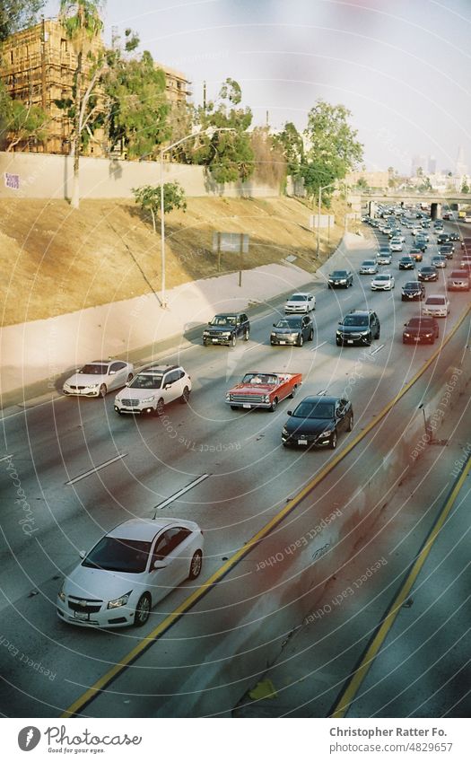 Driving through Los Angeles in a convertible. LA, California. Filmlook Tourism Light warm Tourist Copy Space vacation Vacation mood movie Poster cinematic