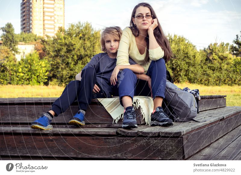 Happy family mom and son spend time resting together in the autumn park having fun, smiling, hugging Mental health Relax on nature happy mother girl boy woman