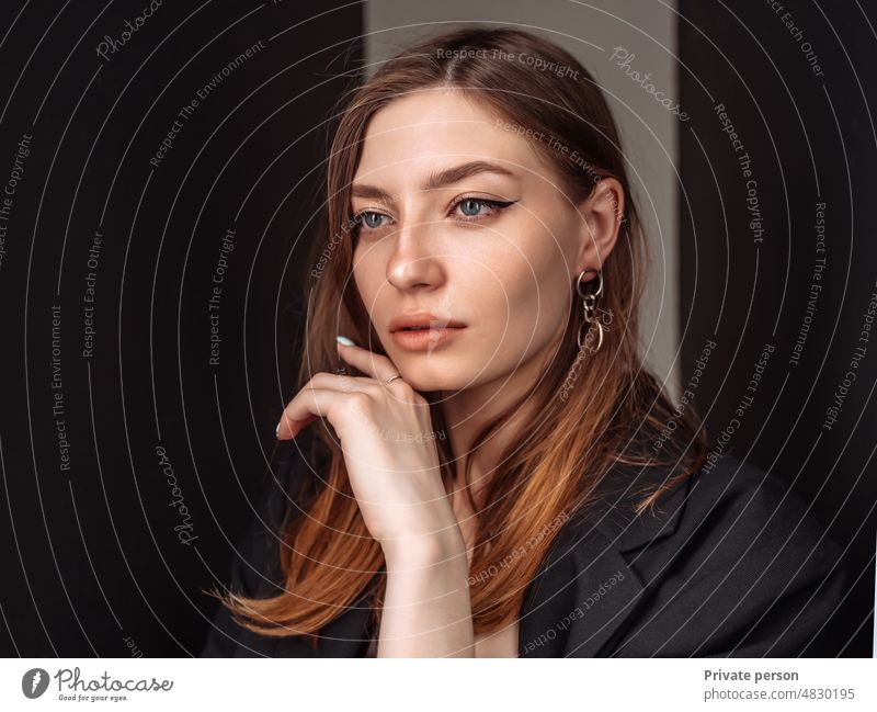 Portrait of businesswoman. Confident business woman, Proud brunette woman in formalwear manager, employee on a dark background Women Business Adult CEO Pride