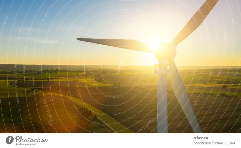 Wind turbines and agricultural fields on a summer day - Energy Production with clean and Renewable Energy - aerial shot wind energy power environment fuel