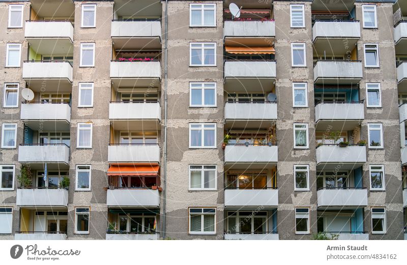 Facade of a block of flats with balconies that is being renovated architecture old house living demolished residential facade skyscraper plattenbau scruffy