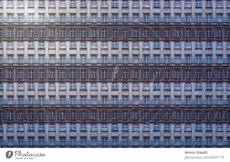 architectural pattern, gloomy old building facade of a berlin house with stucco seamless architecture repetition big huge many anonymous mega city future modern