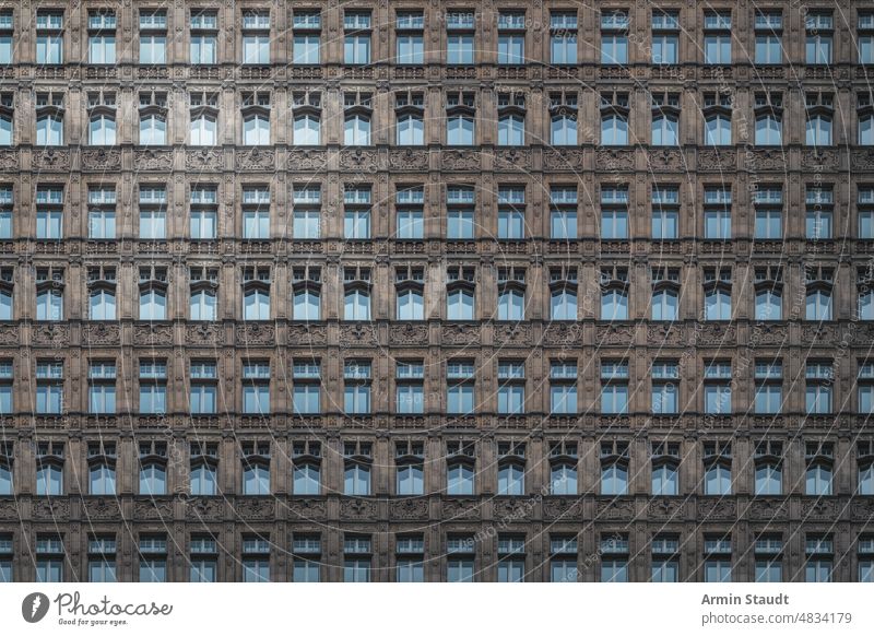 architectural pattern, beautiful old berlin building with filigree decorations and blue windows house stucco seamless architecture facade repetition big huge