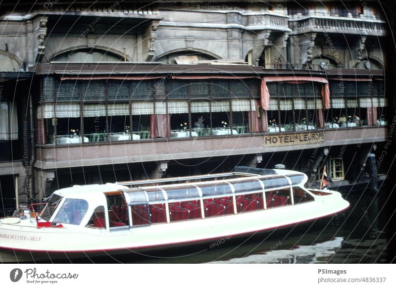 Boat on the Water at Hotel in Amsterdam, Netherlands Holland Travel Tourism Vacation & Travel Canal Historic Exterior Shot Achitecture Boats Tradition