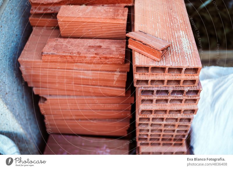 stacked bricks at home in construction site during home improvement renovation nobody works reconstruction house building exterior plastering mason installing