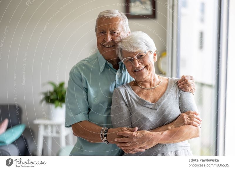 Happy senior couple at home senior adult older aged portrait person casual leisure lifestyle pensioner caucasian retired people mature retirement elderly