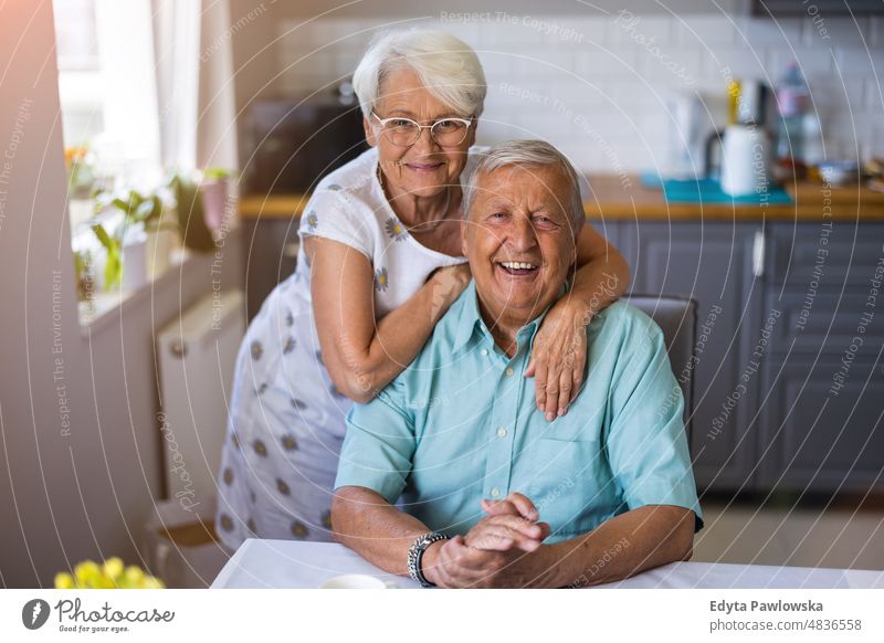 Happy senior couple at home senior adult older aged portrait person casual leisure lifestyle pensioner caucasian retired people mature retirement elderly