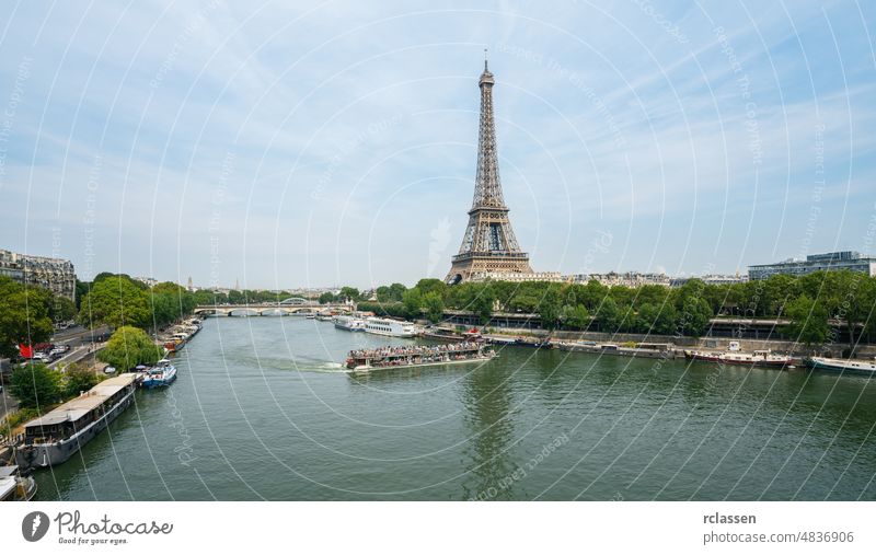 Paris Eiffel Tower and river Seine paris eiffel tower landmark france skyline clear blue sky cityscape aerial europe old town boat defense copy space summer