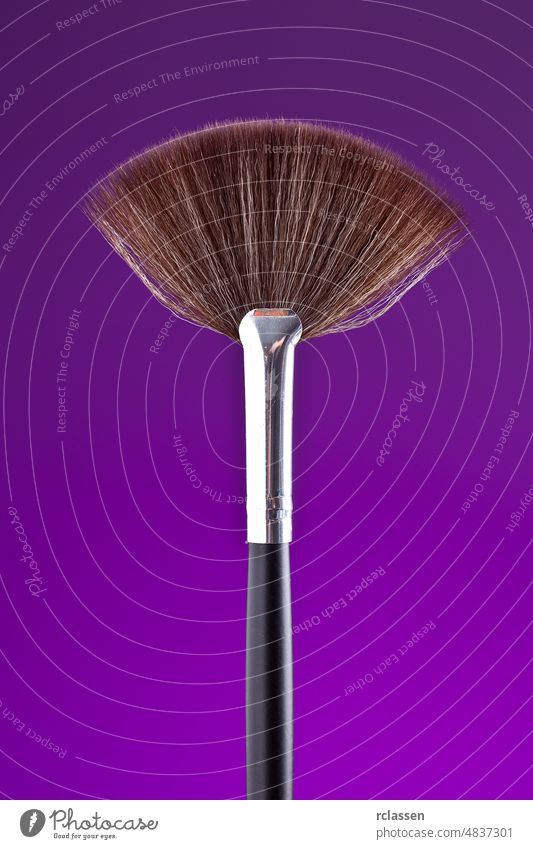 powderbrush on purple background beauty care cheeks color color picture cosmetics drogerie dust elegance eye eyes face fashion female glamour hair make-up