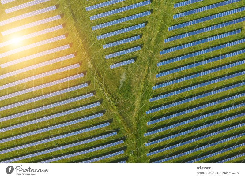 Aerial view of solar power plant. Solar farm system from above. Large photovoltaic power station. Source of ecological renewable energy. aerial panel field