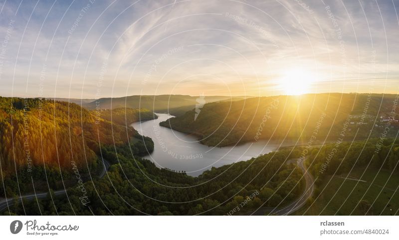 Sunset at the Lake Rursee, Eifel Germany eifel rursee aerial blue drone green sunrise sunset national park nature outside panorama sun flare sunlight reservoir