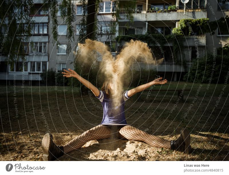 An accidental Aries zodiac sign appears from the sand of this playground. Of course, it has something to do with a gorgeous woman and her pretty long legs. Suburbs of Vilnius and its concrete jungle at its best.