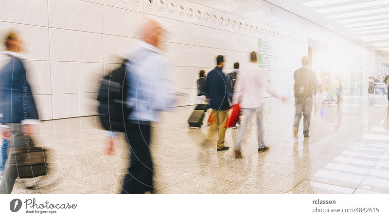 crowd of people walking at a trade fair street london group pedestrian anonymous rush blur mass concept germany seminar shopping frankfurt architecture blurred