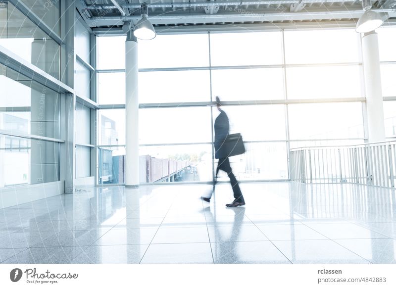 businessman goes along a corridor architecture visitors moving new york frankfurt people trade fair dusseldorf group cologne blur germany messe Exhibition