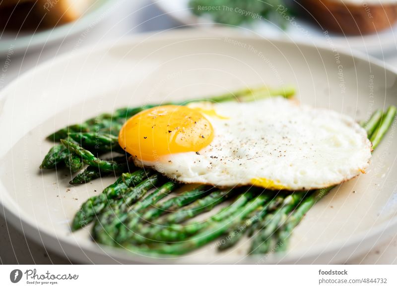 Fried eggs with green asparagus. Fast lunch ideas, healthy breakfast, summer food. brunch cooked cooking cuisine delicious diet dinner dish fresh fried homemade