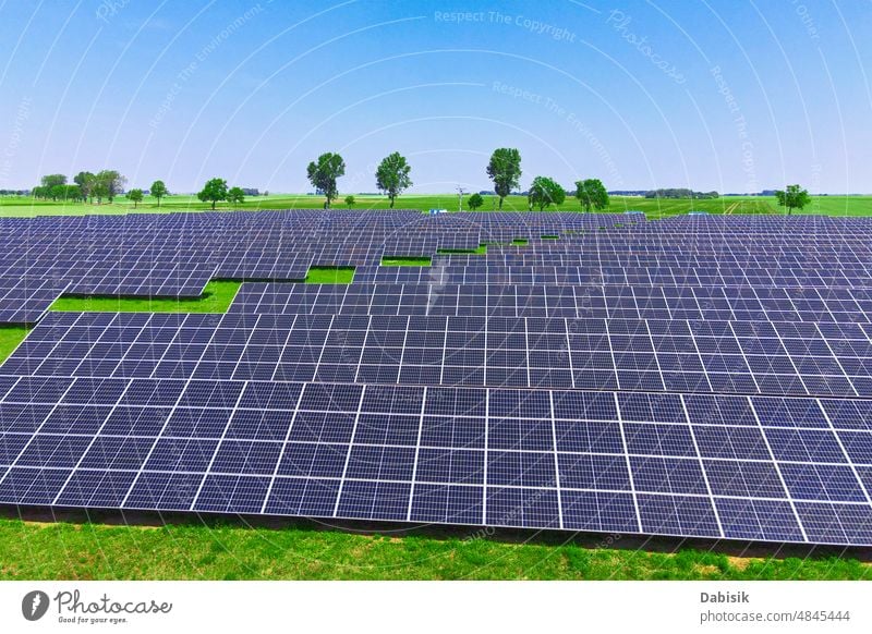 Solar panels in green field, aerial view solar energy photovoltaic renewable sustainable battery power technology clean solar panel solar battery clean energy