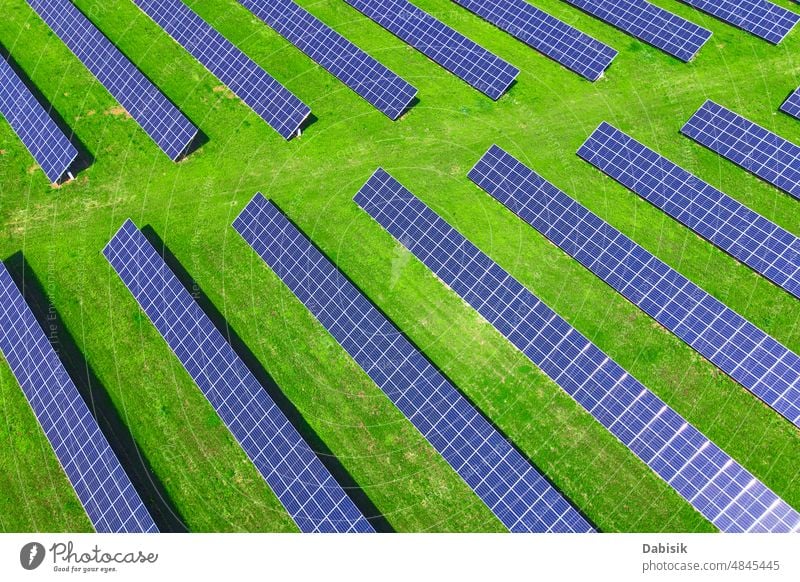 Solar panels in green field, aerial view solar energy photovoltaic renewable sustainable battery power technology clean solar panel solar battery clean energy